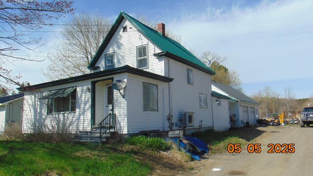 20 Morgan St, Lincoln, ME 04457 - view of front of home with a chimney