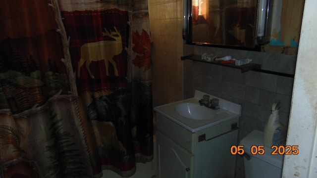 20 Morgan St, Lincoln, ME 04457 - bathroom with tile walls, toilet, vanity, and a shower with curtain