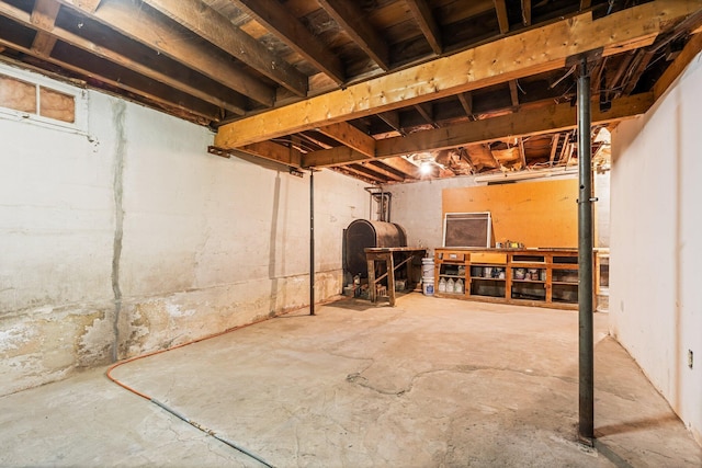 unfinished basement featuring heating fuel