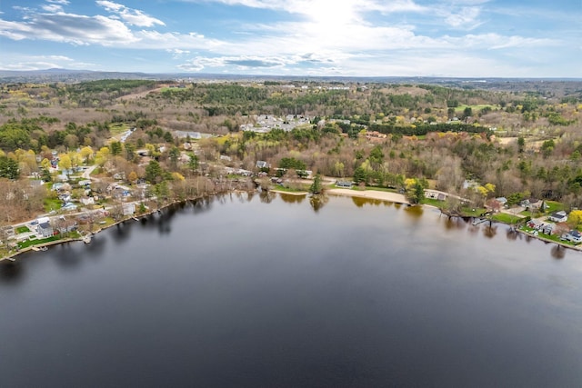 aerial view of property and surrounding area featuring a nearby body of water