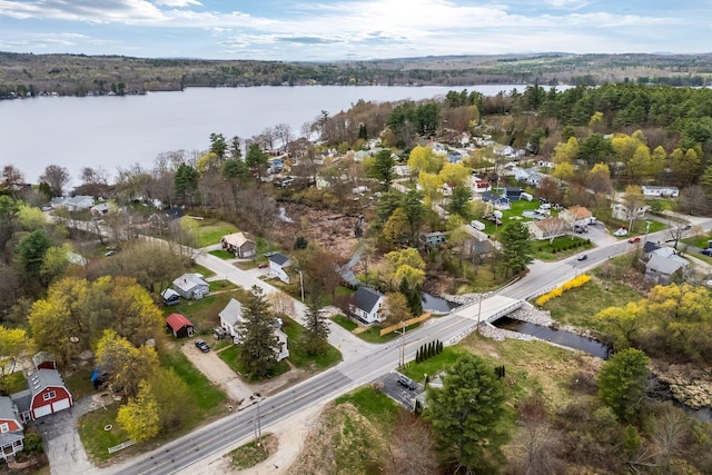 view of property location with a large body of water and nearby suburban area