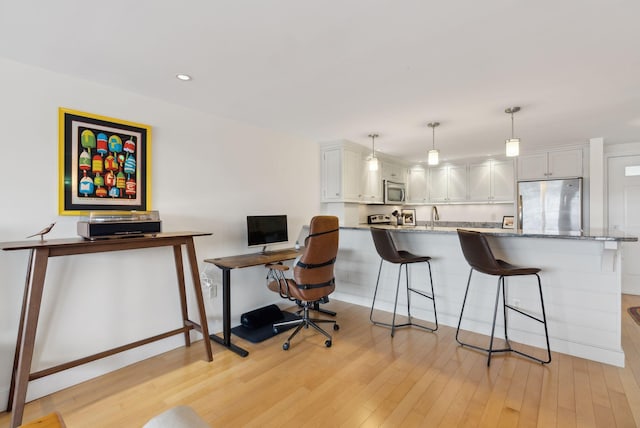 709 Chandlers Wharf Unit 709, Portland, ME 04101 - office area with light wood finished floors, a sink, recessed lighting, and baseboards