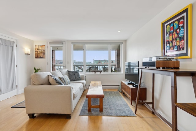 709 Chandlers Wharf Unit 709, Portland, ME 04101 - living area featuring light wood-style flooring, a baseboard radiator, and recessed lighting