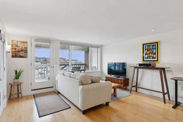 709 Chandlers Wharf Unit 709, Portland, ME 04101 - living room with light wood-style floors, recessed lighting, and baseboards