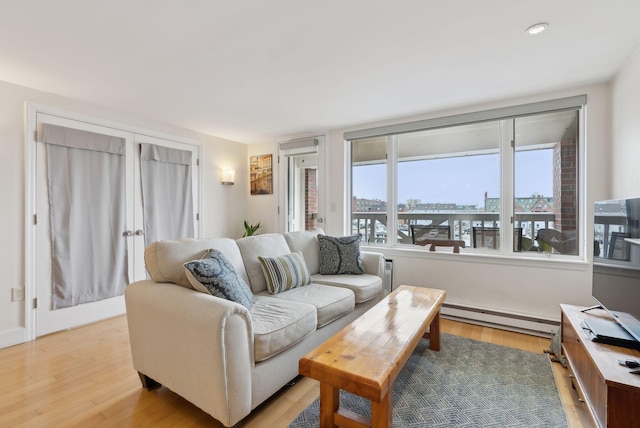 709 Chandlers Wharf Unit 709, Portland, ME 04101 - living area featuring baseboard heating, light wood-style floors, recessed lighting, and baseboards