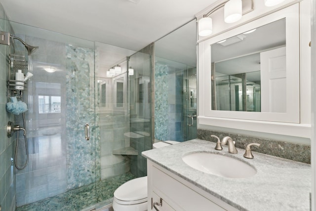 709 Chandlers Wharf Unit 709, Portland, ME 04101 - full bathroom featuring vanity, a shower stall, and toilet
