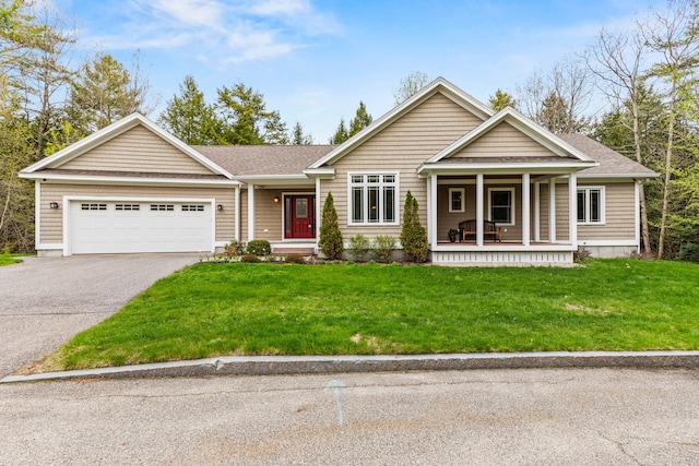 view of front of property featuring a porch, roof with shingles, an attached garage, and driveway