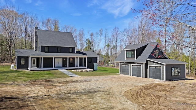 15 County Xing, Brunswick, ME 04011 - modern farmhouse featuring an outbuilding, dirt driveway, a shingled roof, a front yard, and a porch