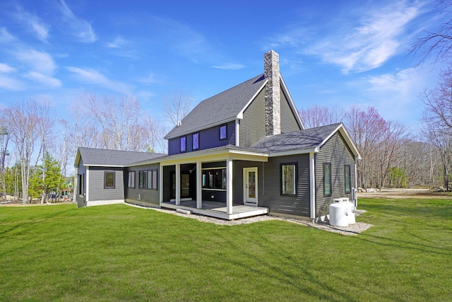 15 County Xing, Brunswick, ME 04011 - rear view of house featuring a shingled roof, a chimney, and a lawn