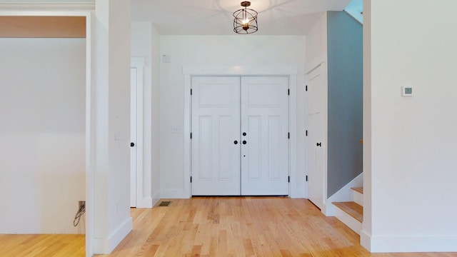 15 County Xing, Brunswick, ME 04011 - entryway featuring baseboards, stairway, and light wood-type flooring