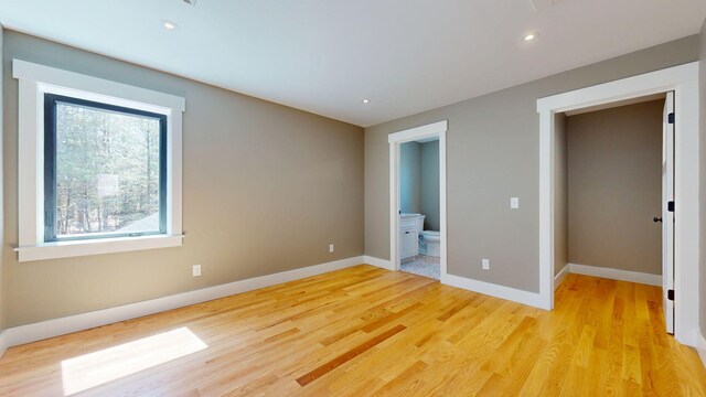 15 County Xing, Brunswick, ME 04011 - unfurnished bedroom featuring baseboards, recessed lighting, light wood finished floors, and ensuite bath