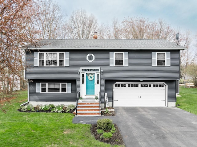 37 Jennifer Ln, Bangor, ME 04401 - raised ranch featuring an attached garage, a front lawn, asphalt driveway, and a chimney