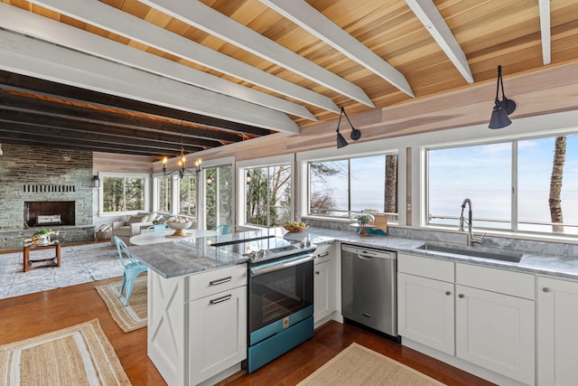 79 Snug Harbor Rd, Standish, ME 04084 - kitchen with stainless steel appliances, a sink, beam ceiling, white cabinetry, and light stone counters