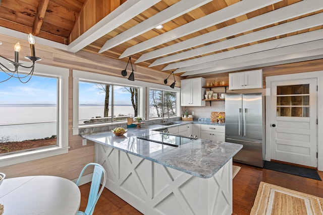 79 Snug Harbor Rd, Standish, ME 04084 - kitchen featuring built in fridge, open shelves, white cabinets, black electric stovetop, and a sink
