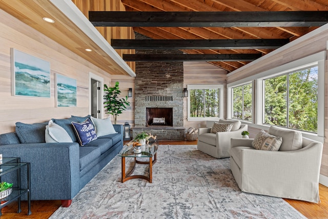 79 Snug Harbor Rd, Standish, ME 04084 - living area with wood finished floors, wood walls, a fireplace, and wooden ceiling