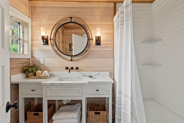 79 Snug Harbor Rd, Standish, ME 04084 - full bathroom featuring wood walls, vanity, and shower / bathtub combination with curtain