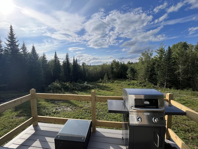 51 Pond Rd, Bradford, ME 04410 - wooden deck featuring a grill and a view of trees