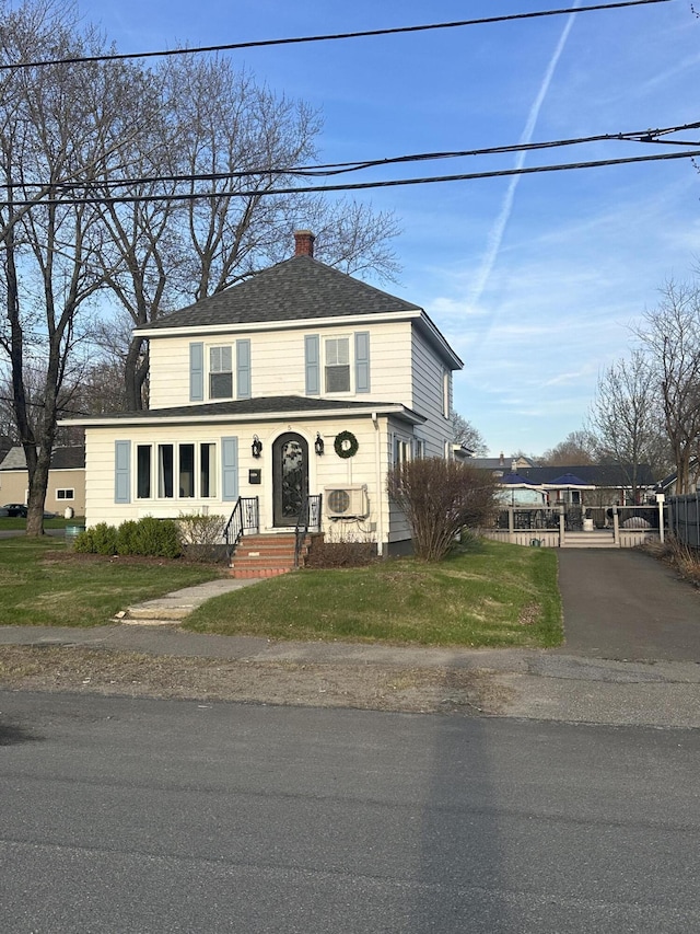5 Cone St, East Millinocket, ME 04430 - traditional-style home featuring a chimney, asphalt driveway, and a shingled roof