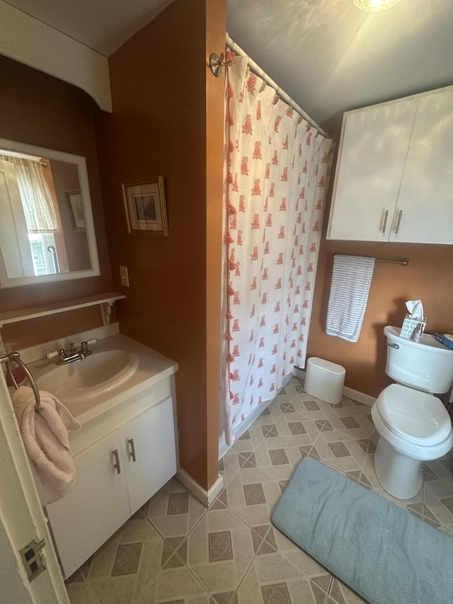5 Cone St, East Millinocket, ME 04430 - bathroom with toilet, a shower with shower curtain, vanity, tile patterned flooring, and baseboards