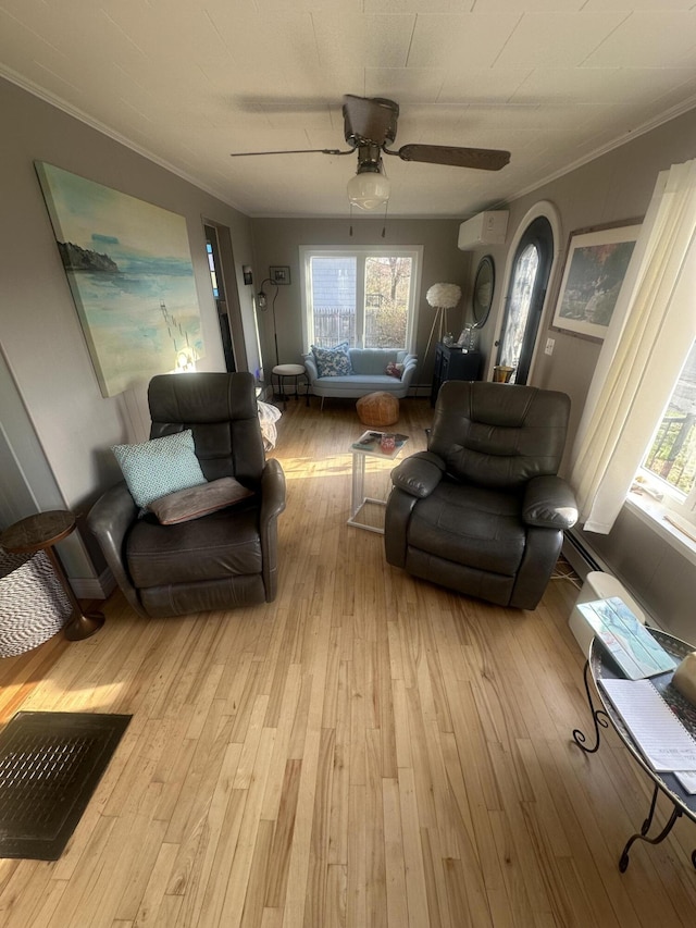 5 Cone St, East Millinocket, ME 04430 - living room with a wall mounted air conditioner, ornamental molding, wood-type flooring, a ceiling fan, and arched walkways