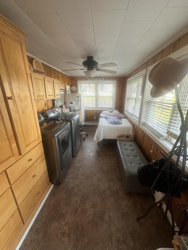 5 Cone St, East Millinocket, ME 04430 - bedroom featuring wooden walls, washer and clothes dryer, and ceiling fan