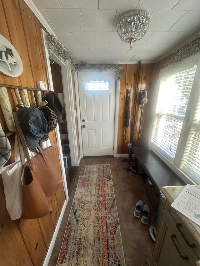5 Cone St, East Millinocket, ME 04430 - entryway featuring wood walls and ornamental molding