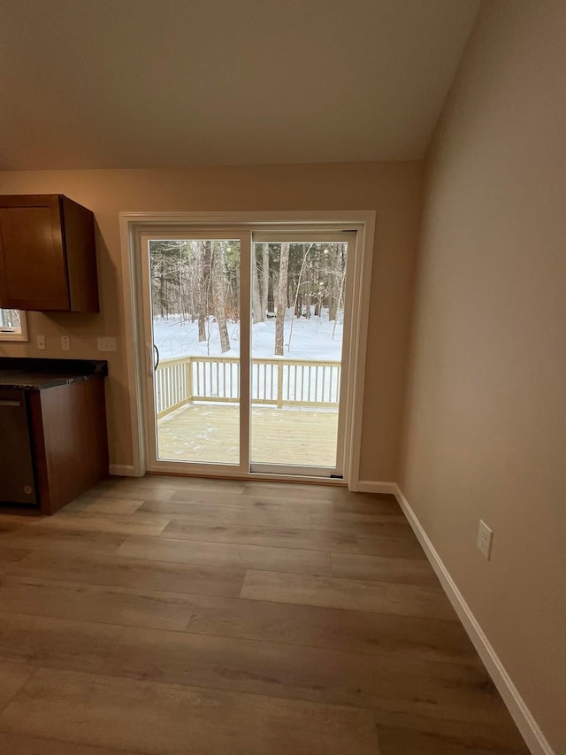 LOT22F Dunton Rd, Naples, ME 04055 - unfurnished dining area with baseboards and light wood-style flooring
