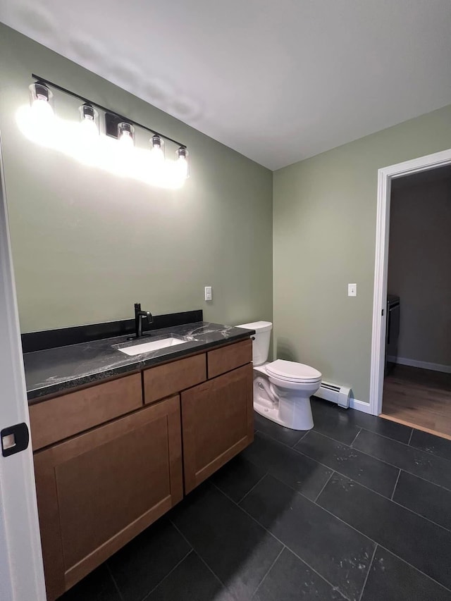 LOT22F Dunton Rd, Naples, ME 04055 - half bath featuring a baseboard heating unit, vanity, and tile patterned flooring