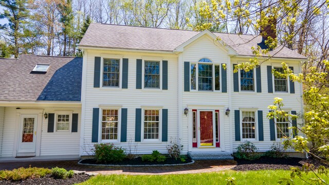 196 Eaton Ridge Dr, Holden, ME 04429 - colonial house featuring a chimney and a shingled roof