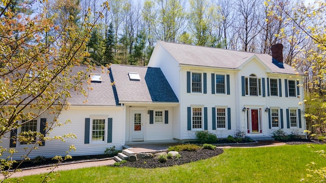 196 Eaton Ridge Dr, Holden, ME 04429 - colonial home featuring a chimney, a front yard, and roof with shingles