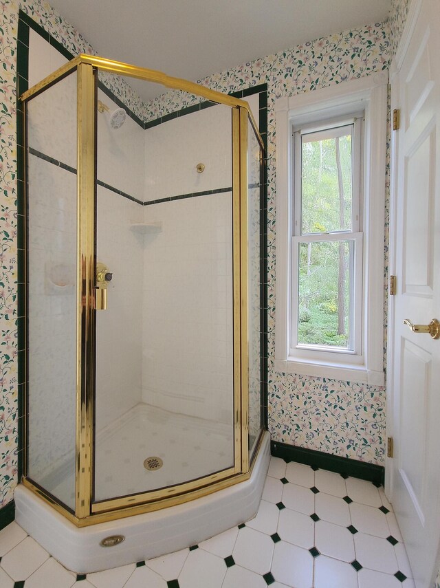196 Eaton Ridge Dr, Holden, ME 04429 - bathroom featuring a stall shower, baseboards, and wallpapered walls