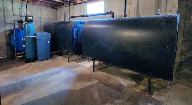 196 Eaton Ridge Dr, Holden, ME 04429 - basement with oil tank and a water pressure tank