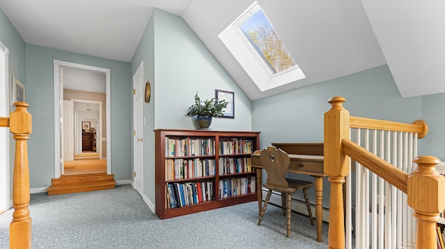 196 Eaton Ridge Dr, Holden, ME 04429 - carpeted office featuring a skylight, lofted ceiling, a baseboard radiator, and baseboards