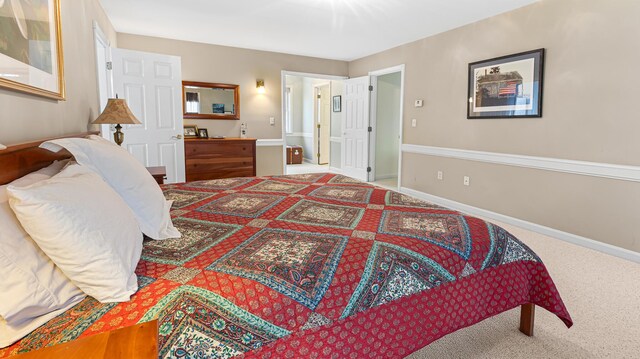 196 Eaton Ridge Dr, Holden, ME 04429 - bedroom featuring carpet floors, baseboards, and ensuite bathroom