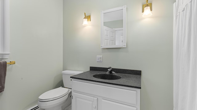196 Eaton Ridge Dr, Holden, ME 04429 - bathroom with toilet, vanity, and baseboard heating