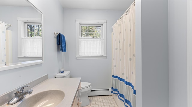 196 Eaton Ridge Dr, Holden, ME 04429 - full bathroom with baseboard heating, healthy amount of natural light, toilet, and vanity