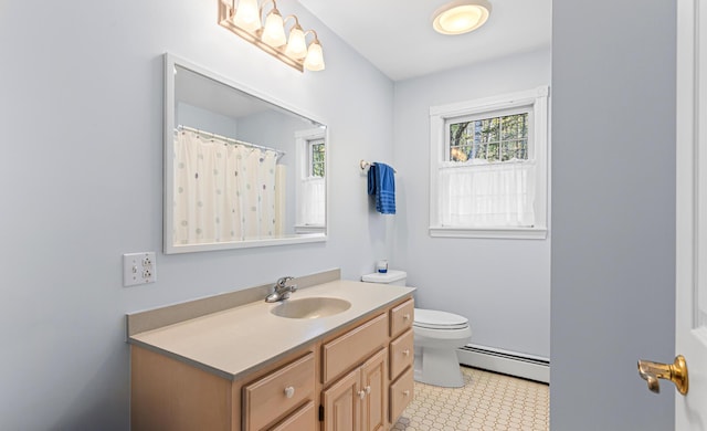 196 Eaton Ridge Dr, Holden, ME 04429 - bathroom with a baseboard radiator, toilet, vanity, and tile patterned floors