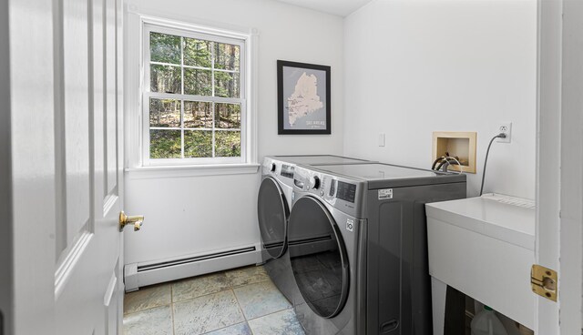196 Eaton Ridge Dr, Holden, ME 04429 - clothes washing area featuring separate washer and dryer, a baseboard radiator, and stone tile flooring