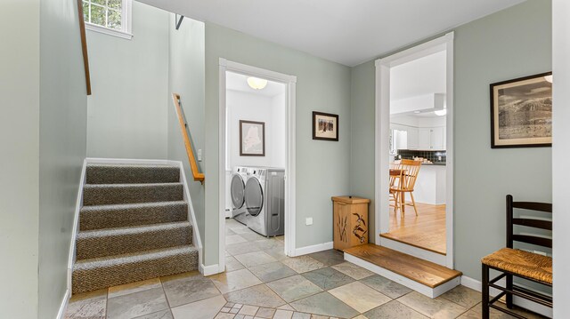 196 Eaton Ridge Dr, Holden, ME 04429 - staircase with washing machine and dryer and baseboards