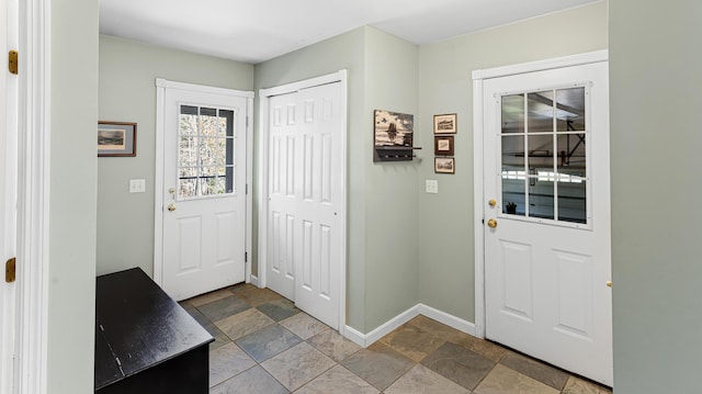 196 Eaton Ridge Dr, Holden, ME 04429 - entrance foyer with light stone finish flooring and baseboards