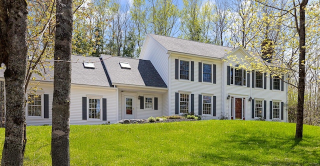 196 Eaton Ridge Dr, Holden, ME 04429 - colonial home with a chimney, a front lawn, and a shingled roof