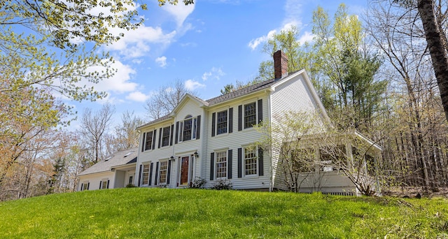 196 Eaton Ridge Dr, Holden, ME 04429 - colonial house with a chimney and a front yard