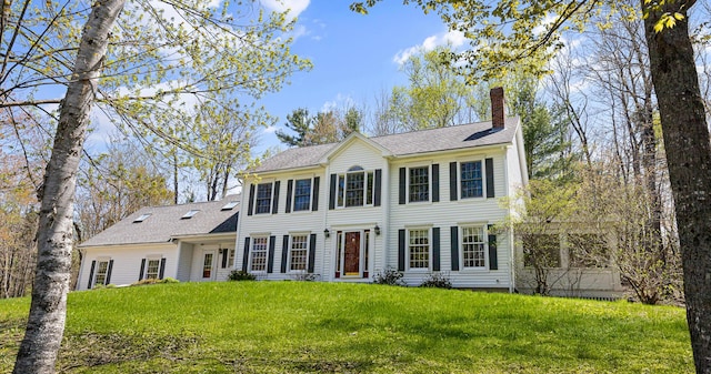 196 Eaton Ridge Dr, Holden, ME 04429 - colonial inspired home featuring a chimney, a front lawn, and roof with shingles