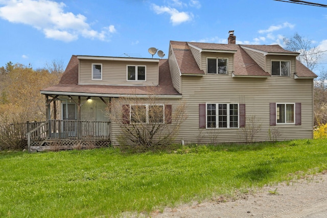 20 Crystal Spring Ln, Rome, ME 04963 - back of house with a porch, a chimney, roof with shingles, and a yard