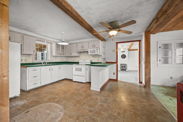 20 Crystal Spring Ln, Rome, ME 04963 - kitchen featuring white appliances, dark countertops, a peninsula, a sink, and under cabinet range hood