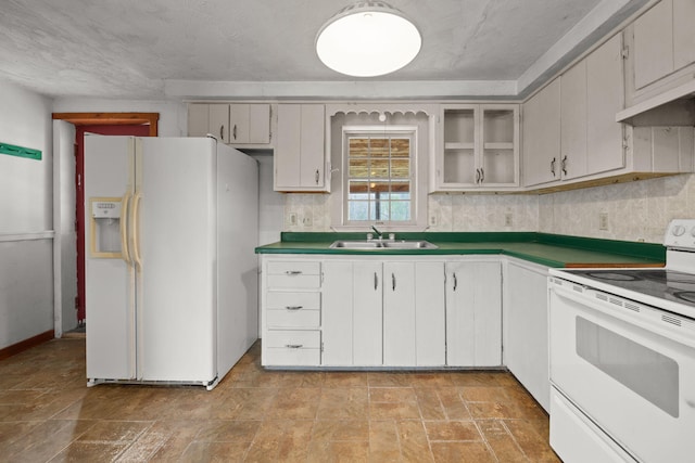 20 Crystal Spring Ln, Rome, ME 04963 - kitchen featuring white appliances, a sink, under cabinet range hood, glass insert cabinets, and light stone finish floors