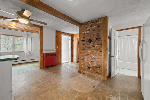 20 Crystal Spring Ln, Rome, ME 04963 - entrance foyer featuring a baseboard radiator, radiator heating unit, ceiling fan, wooden walls, and beamed ceiling