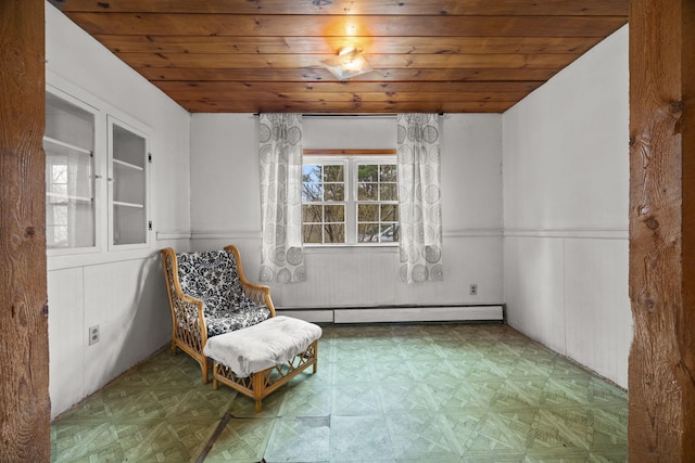 20 Crystal Spring Ln, Rome, ME 04963 - living area featuring wood ceiling, baseboard heating, and wainscoting
