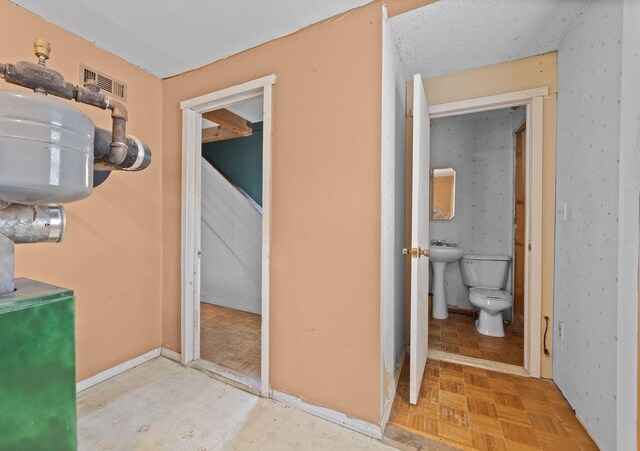 20 Crystal Spring Ln, Rome, ME 04963 - bathroom with toilet, a sink, and baseboards