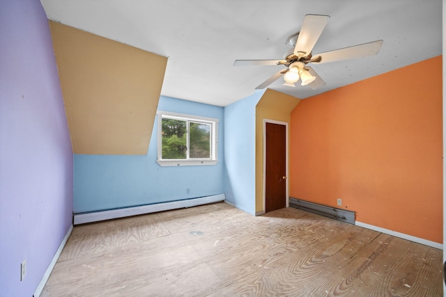 20 Crystal Spring Ln, Rome, ME 04963 - bonus room featuring baseboard heating, a ceiling fan, vaulted ceiling, and wood finished floors